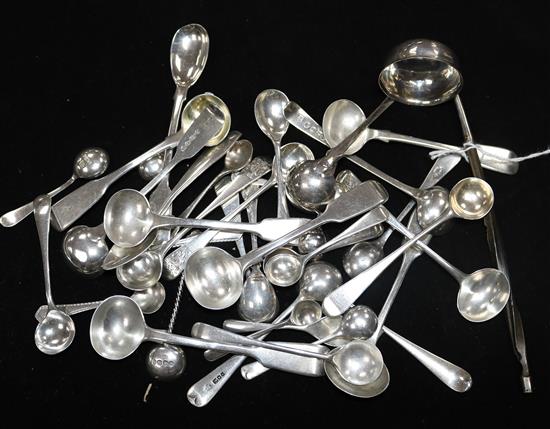 A small silver toddy ladle and a collection of Georgian and later silver condiment spoons